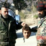 Syrian soldiers taking photos with severed rebel heads
