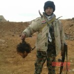 Syrian soldiers taking photos with severed rebel heads