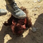Syrian soldiers taking photos with severed rebel heads
