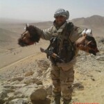 Syrian soldiers taking photos with severed rebel heads