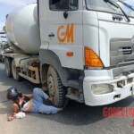 Young woman's leg is crushed by concrete mixer truck