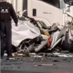 Car loses control and hits truck, one dead
