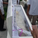 Funeral of Indonesian woman with open casket