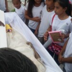 Funeral of Indonesian woman with open casket