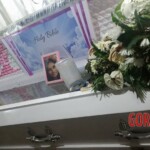 Funeral of Indonesian woman with open casket