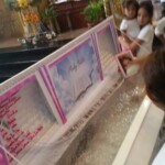 Funeral of Indonesian woman with open casket