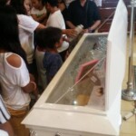 Funeral of Indonesian woman with open casket