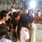 Funeral of Indonesian woman with open casket