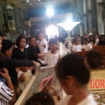 Funeral of Indonesian woman with open casket