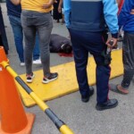 Man talking on phone surprised by hitman