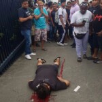 Man talking on phone surprised by hitman