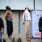 Public execution of two rapists in Iran