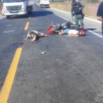 Two men on motorcycle died in head-on crash with truck