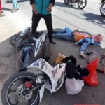Vietnamese woman falls from scooter under truck