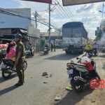 Vietnamese woman falls from scooter under truck