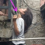 Young woman found hanging from balcony