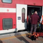 Young female soldier loses consciousness and falls under train