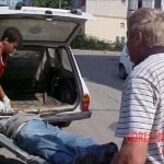 Dead homeless man found between two cars