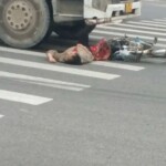 Middle-aged woman has her lower part crushed by concrete truck