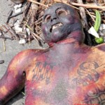 Tied male corpse washed up on shore