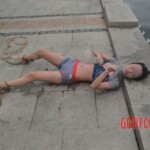 Drowned young Chinese woman pulled from river