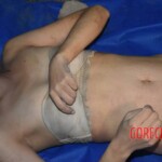 Dead woman pulled from submerged car