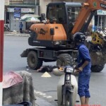 Pedestrian run over by excavator in the middle of intersection