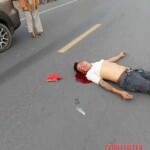 Two men on moped collide head-on with car