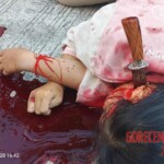 Woman’s body found with knife plunged deep into her neck