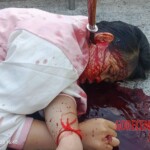 Woman’s body found with knife plunged deep into her neck