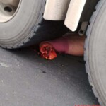 Female biker crushed by heavy truck