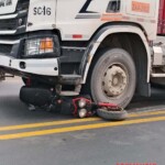 Female biker crushed by heavy truck