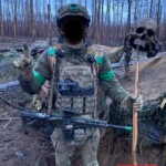 Ukrainian soldiers pose with Russian soldier’s skull