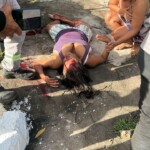Runaway car crushes woman at bus stop