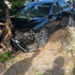 Runaway car crushes woman at bus stop