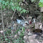 Burying two fallen Russian soldiers in shallow grave